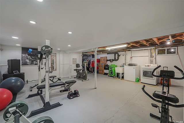 workout room with separate washer and dryer and sink