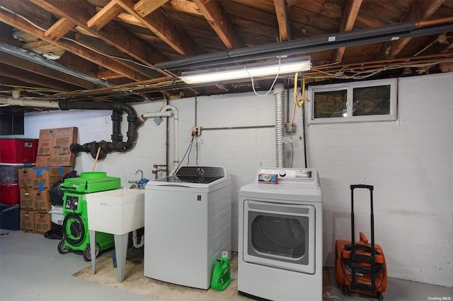 clothes washing area featuring independent washer and dryer