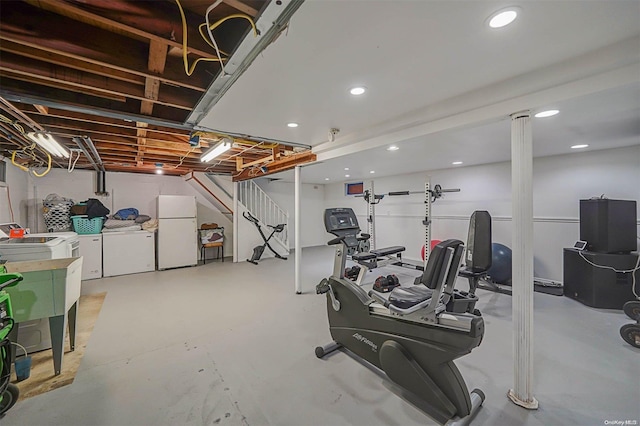 exercise area featuring washer and clothes dryer