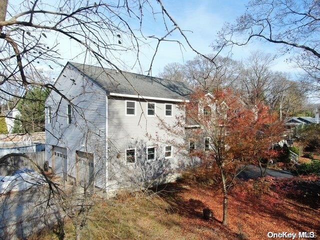 view of side of property featuring a garage