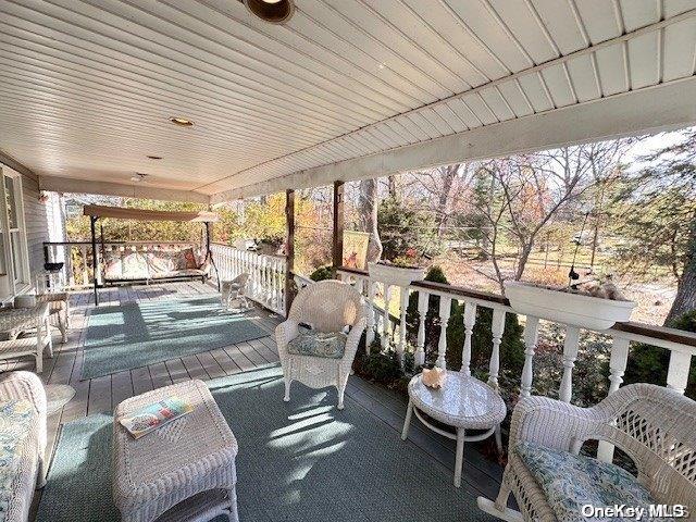 wooden deck featuring covered porch