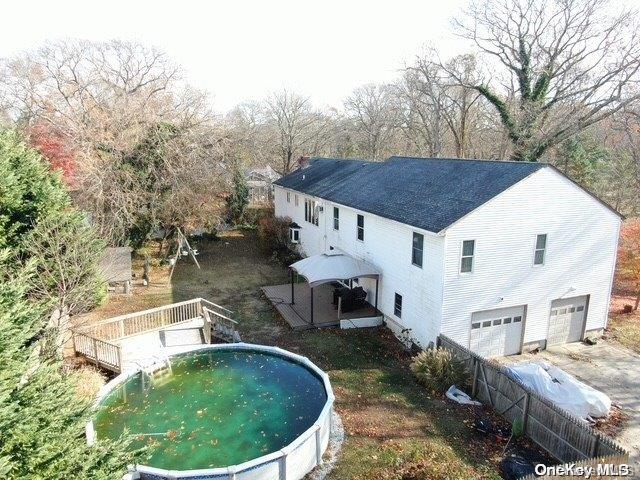 back of property featuring a garage