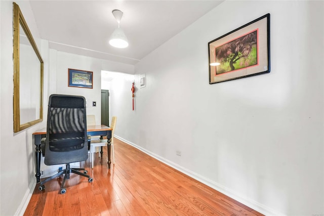 office space with wood-type flooring