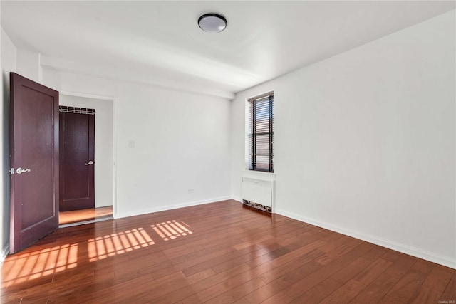 empty room with wood-type flooring