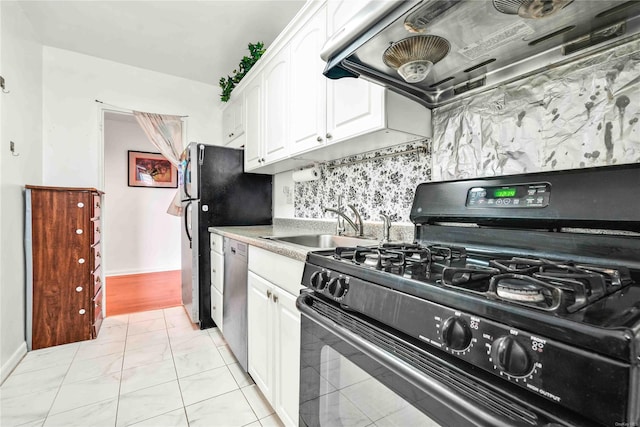 kitchen featuring exhaust hood, sink, tasteful backsplash, gas stove, and white cabinetry