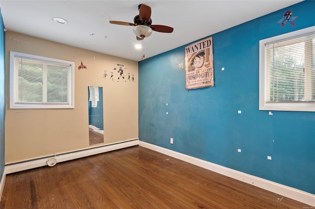 unfurnished room with baseboard heating, ceiling fan, and hardwood / wood-style flooring