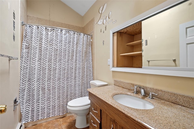 bathroom with vanity, vaulted ceiling, tile patterned flooring, toilet, and walk in shower