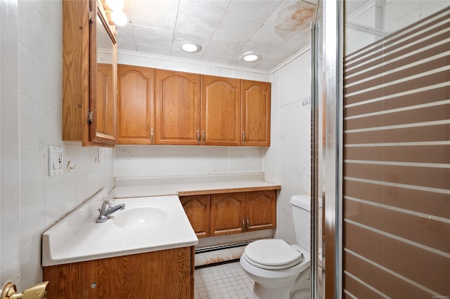 bathroom featuring tile patterned flooring, vanity, toilet, and ornamental molding