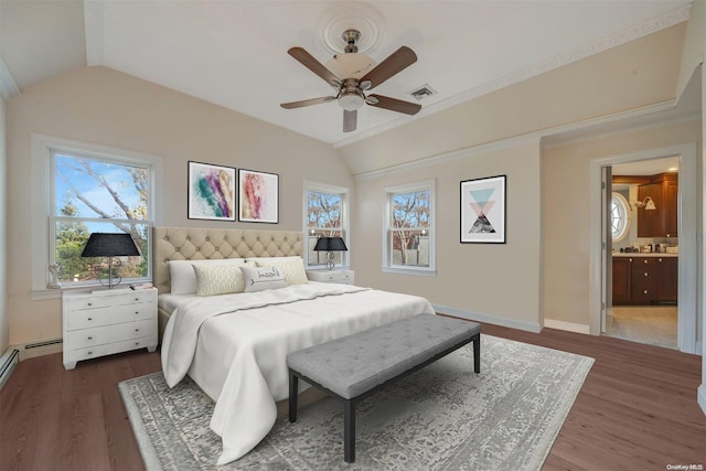 bedroom featuring multiple windows, vaulted ceiling, and dark hardwood / wood-style flooring