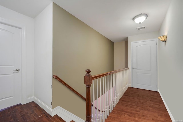 stairway with wood-type flooring