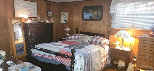 bedroom with wooden walls