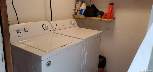 washroom with washer and dryer