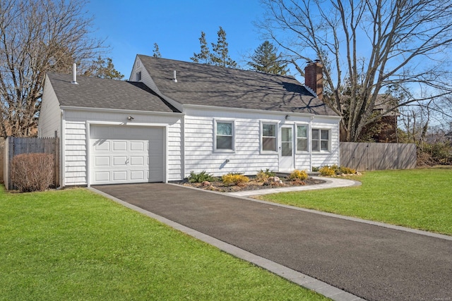 cape cod-style house with a front lawn, aphalt driveway, fence, an attached garage, and a chimney