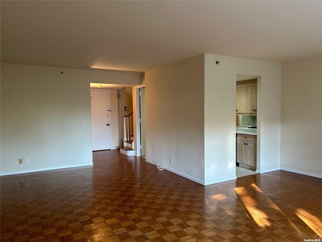 empty room featuring dark parquet floors