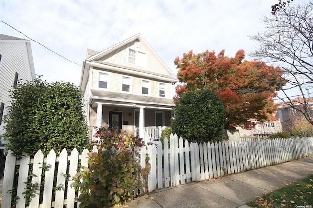 view of property with covered porch