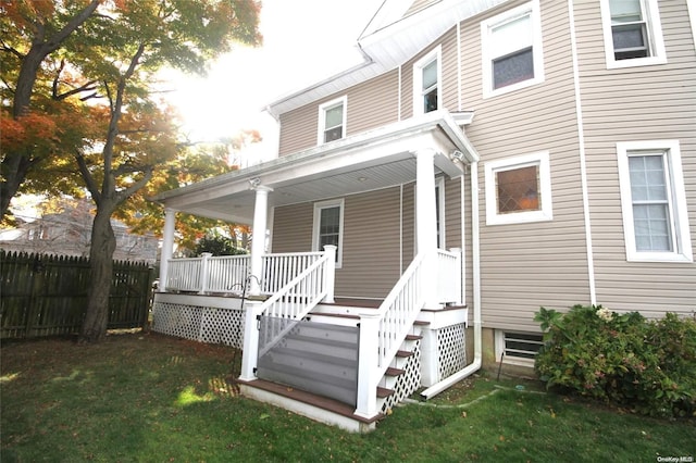 property entrance with a yard