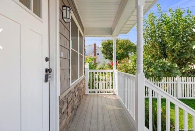 wooden terrace with a porch