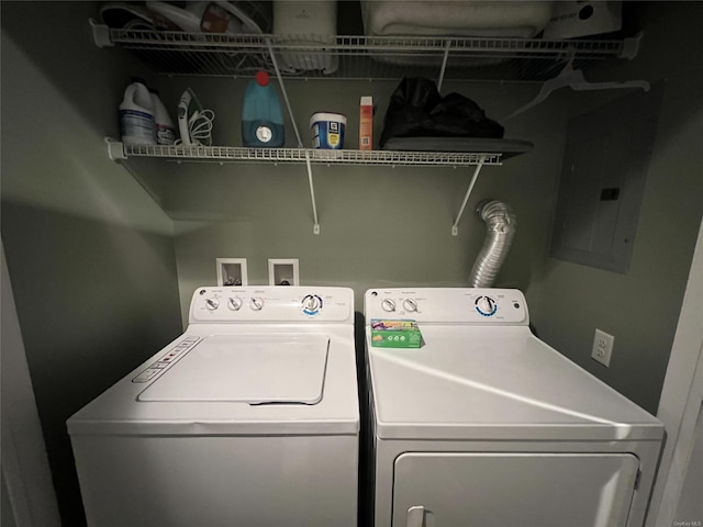 clothes washing area featuring washing machine and clothes dryer and electric panel