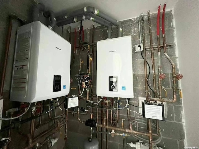 utility room featuring tankless water heater