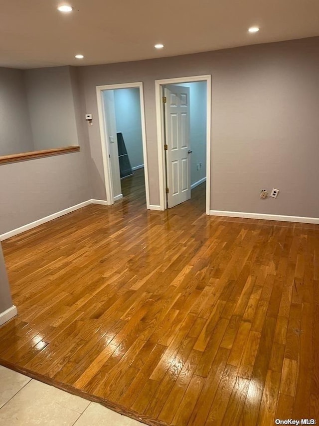 unfurnished room featuring hardwood / wood-style floors