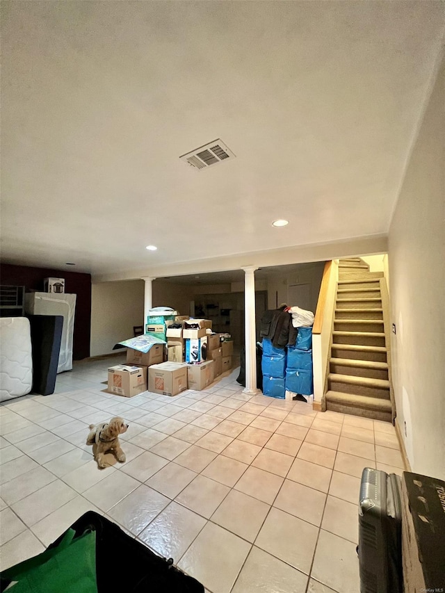 unfurnished living room with light tile patterned floors