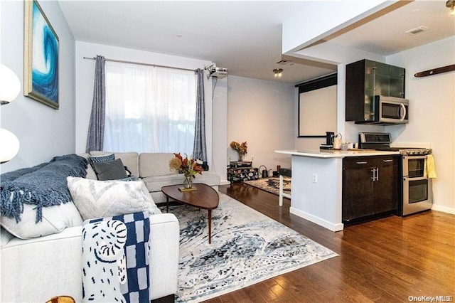 living room featuring dark hardwood / wood-style floors