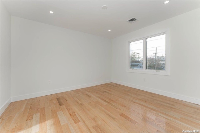 spare room with light wood-type flooring