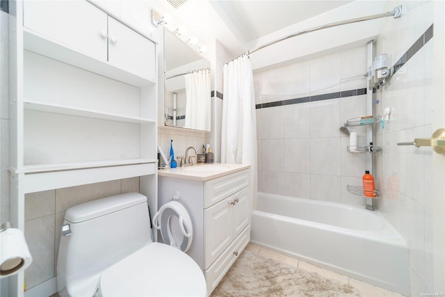 full bathroom with tile patterned floors, vanity, toilet, and shower / bathtub combination with curtain