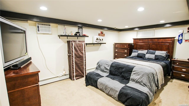 bedroom featuring a wall mounted air conditioner, light colored carpet, and a baseboard heating unit