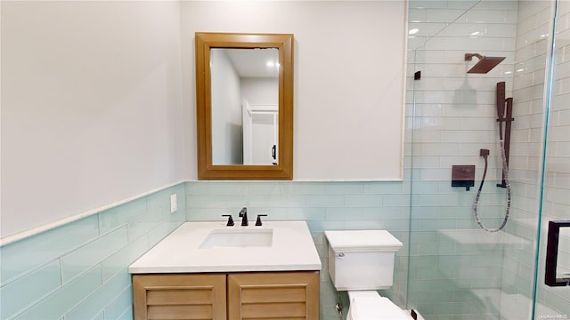 80 Albany Blvd, Atlantic Beach, NY 11509 - bathroom with vanity, tile walls, a shower stall, toilet, and a wainscoted wall