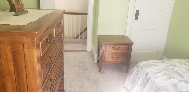 bedroom with light carpet