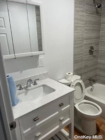 59 Port Washington Ave, Sound Beach, NY 11789 - full bathroom with vanity, bathtub / shower combination, and toilet
