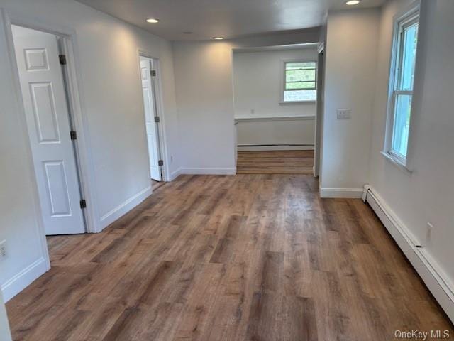 59 Port Washington Ave, Sound Beach, NY 11789 - spare room with a baseboard radiator, baseboards, wood finished floors, and recessed lighting