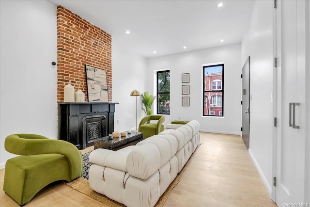 448 Halsey St, Stuyvesant Hts, NY 11233 - living area featuring light wood-type flooring, a fireplace, and recessed lighting