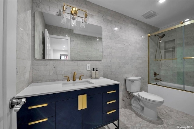448 Halsey St, Stuyvesant Hts, NY 11233 - bathroom with tile walls, vanity, bath / shower combo with glass door, and tile patterned floors