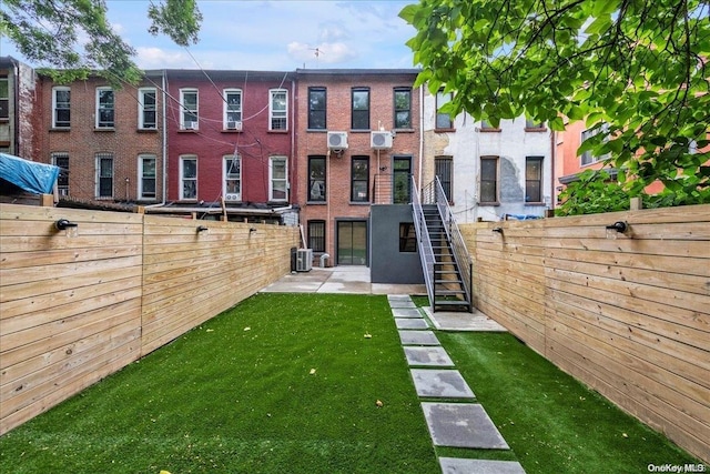 view of yard with a patio and central air condition unit