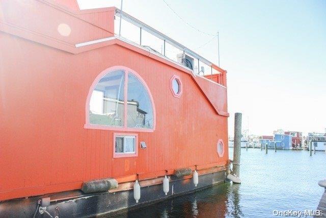 view of side of home featuring a water view