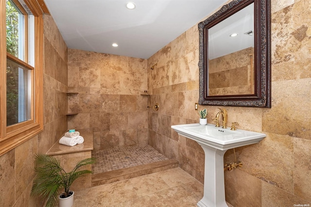 bathroom with tile walls