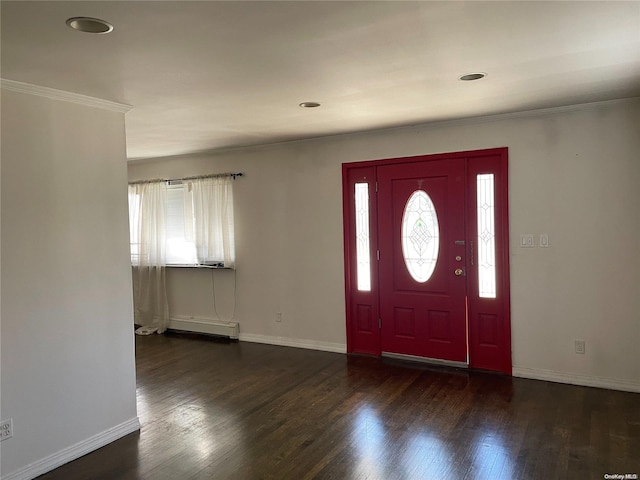 entryway featuring dark hardwood / wood-style floors, crown molding, and a baseboard heating unit