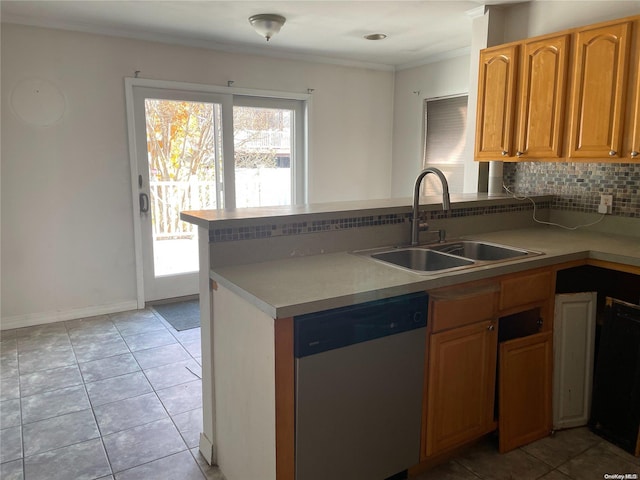 kitchen with backsplash, dishwasher, light tile patterned floors, and sink