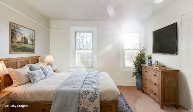 bedroom featuring light carpet