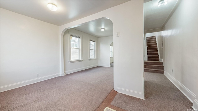 empty room with carpet flooring