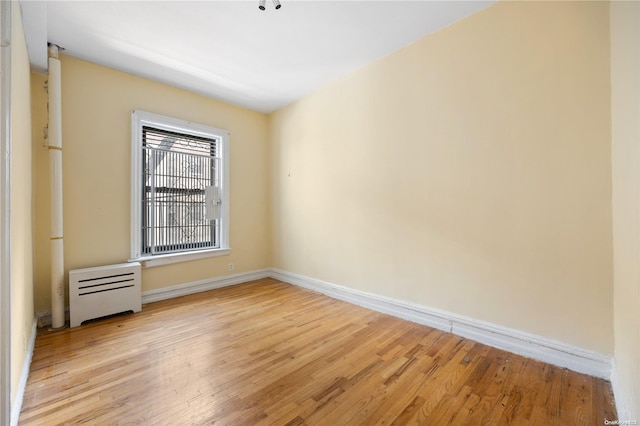 spare room with light hardwood / wood-style floors