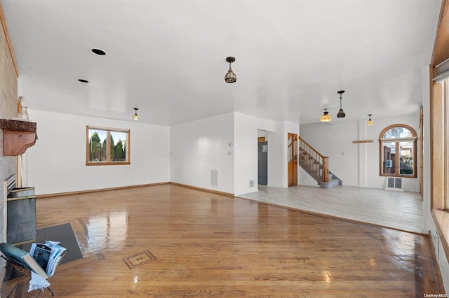 unfurnished living room with light wood-type flooring