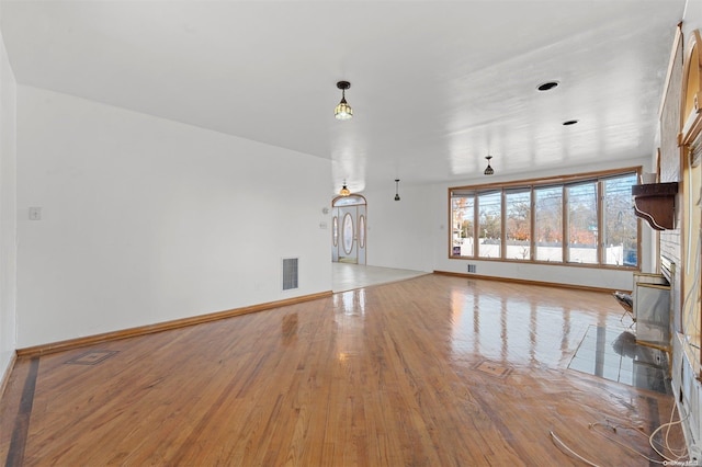 unfurnished living room with light hardwood / wood-style flooring