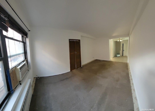 empty room featuring carpet floors and ceiling fan