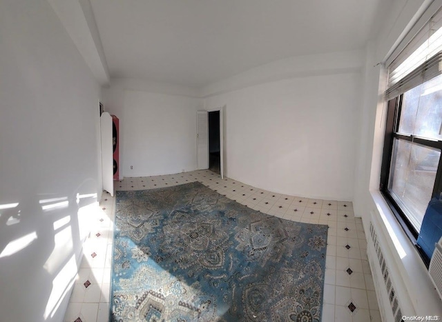 spare room with tile patterned flooring