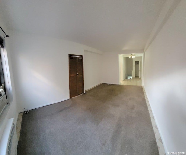 unfurnished room featuring light colored carpet