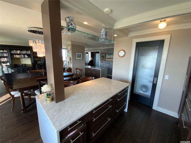 kitchen featuring a kitchen island and dark wood-type flooring