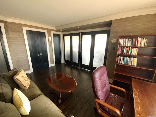 living room featuring dark hardwood / wood-style flooring and crown molding